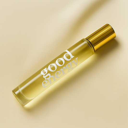 Roll-on bottle with 'good energy' text on a beige background
